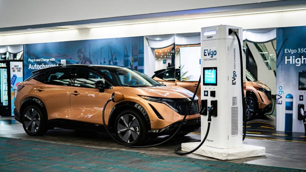 An electric automobile being charged