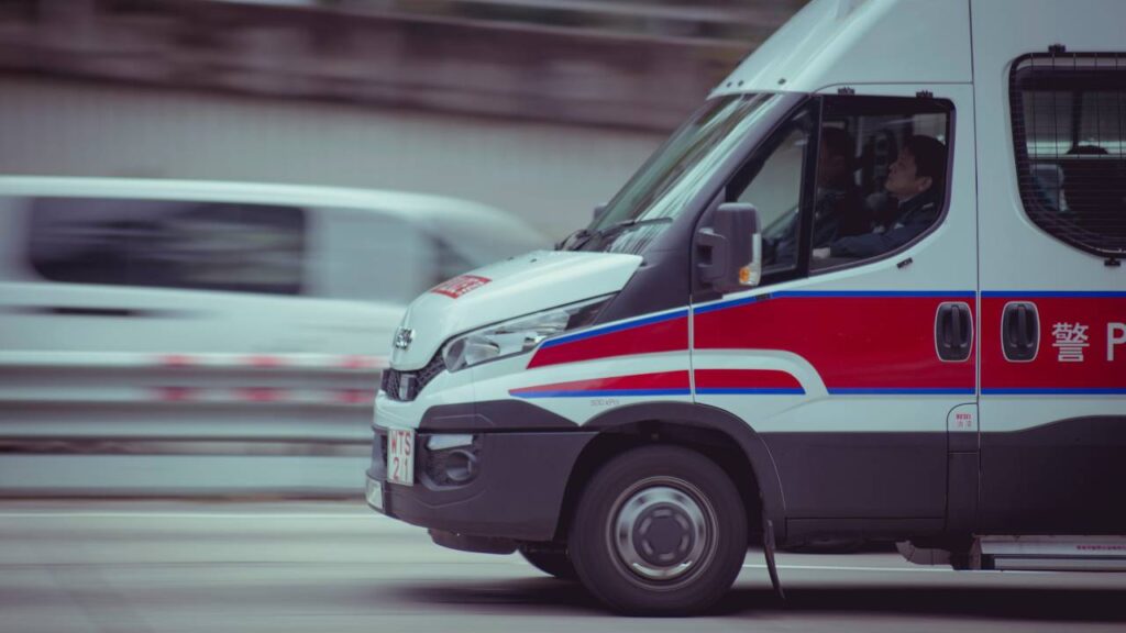 A photo of a white van going down the road