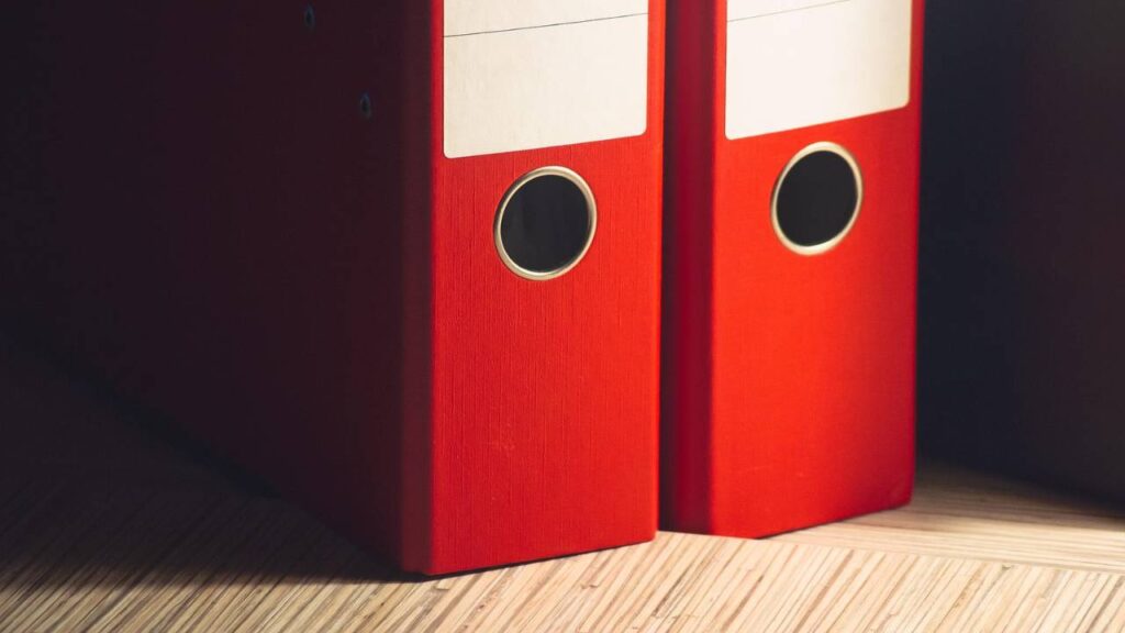 Two file folders on a table